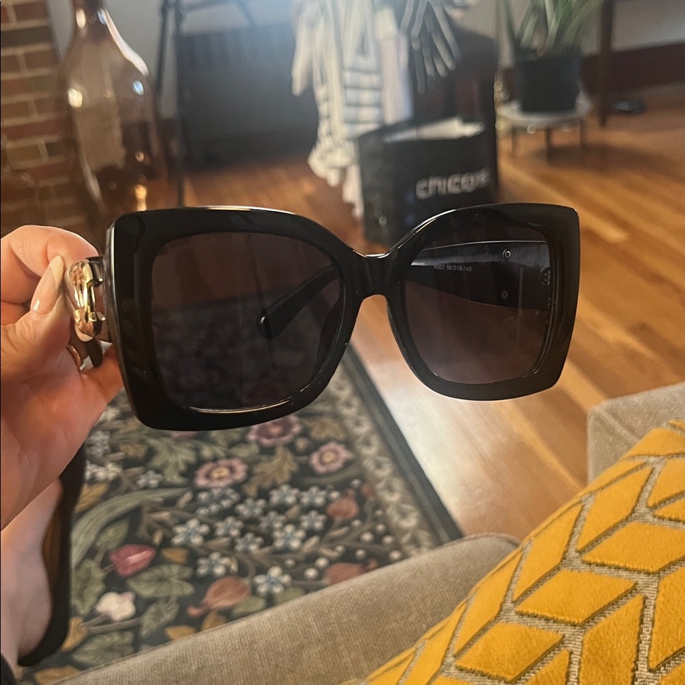 CHANEL Glossy Black Sunglasses with Gold Accent - Picture 2 of 3